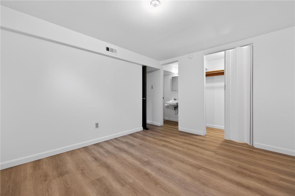 213 Tilford Road Pittsburgh, PA 15235 - Photo 12 of 20 a view of an empty room with wooden floor