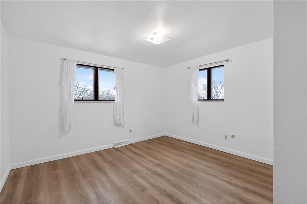 213 Tilford Road Pittsburgh, PA 15235 - Photo 16 of 20 a view of empty room with wooden floor