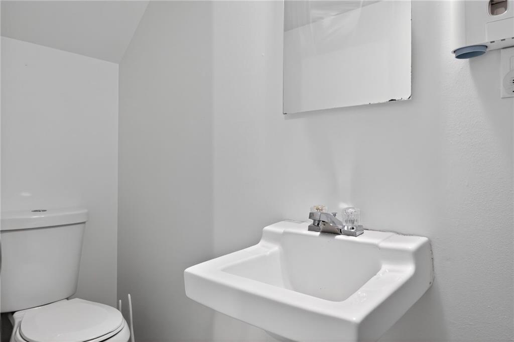 213 Tilford Road Pittsburgh, PA 15235 - Photo 4 of 20 a white toilet sitting next to a white sink