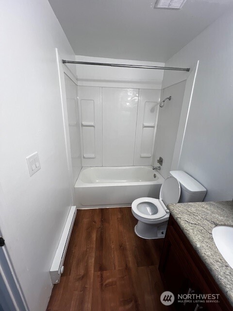 2716 South 258th Place Kent, WA 98032 - Photo 6 of 11 a bathroom with a granite countertop bathtub sink vanity mirror and toilet