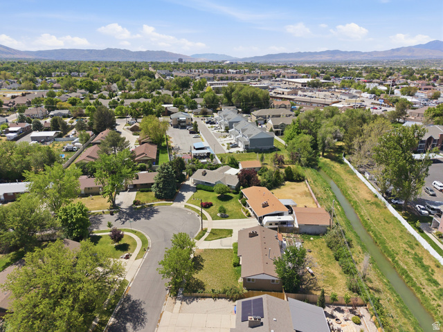 148 Tennyson Avenue Sandy, UT 84070 - Photo 54 of 55 Residential area featuring various single-family homes, mature trees, and a cul-de-sac