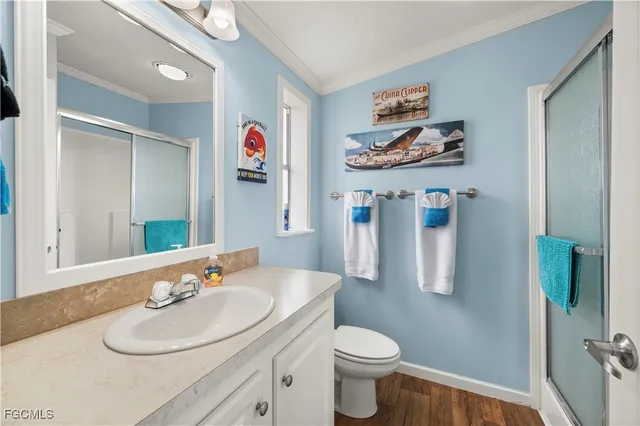 a bathroom with a sink a mirror and a toilet