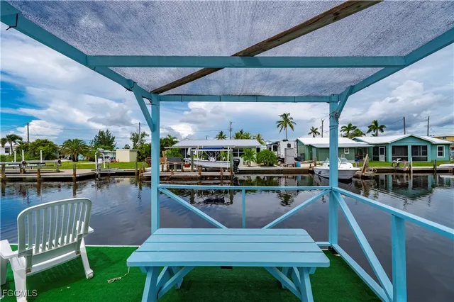 a view of a swimming pool with chairs