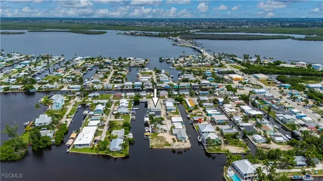 an aerial view of a houses with outdoor space