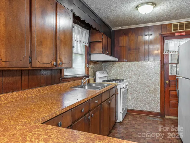 a kitchen with a sink and cabinets