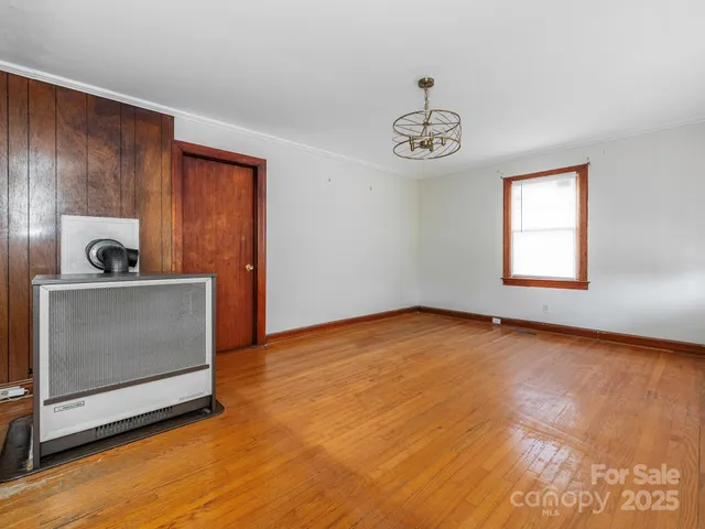 a view of a room with wooden floor and sink