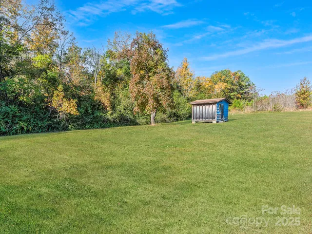 a backyard of a house with lots of green space