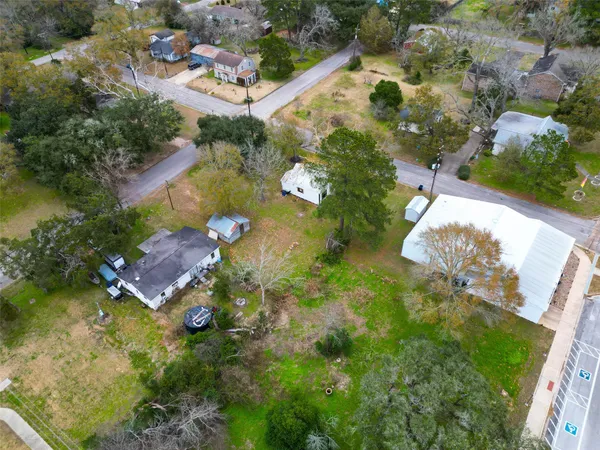 an aerial view of residential house with outdoor space and swimming pool