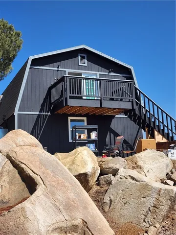 a view of a house with snow in the background