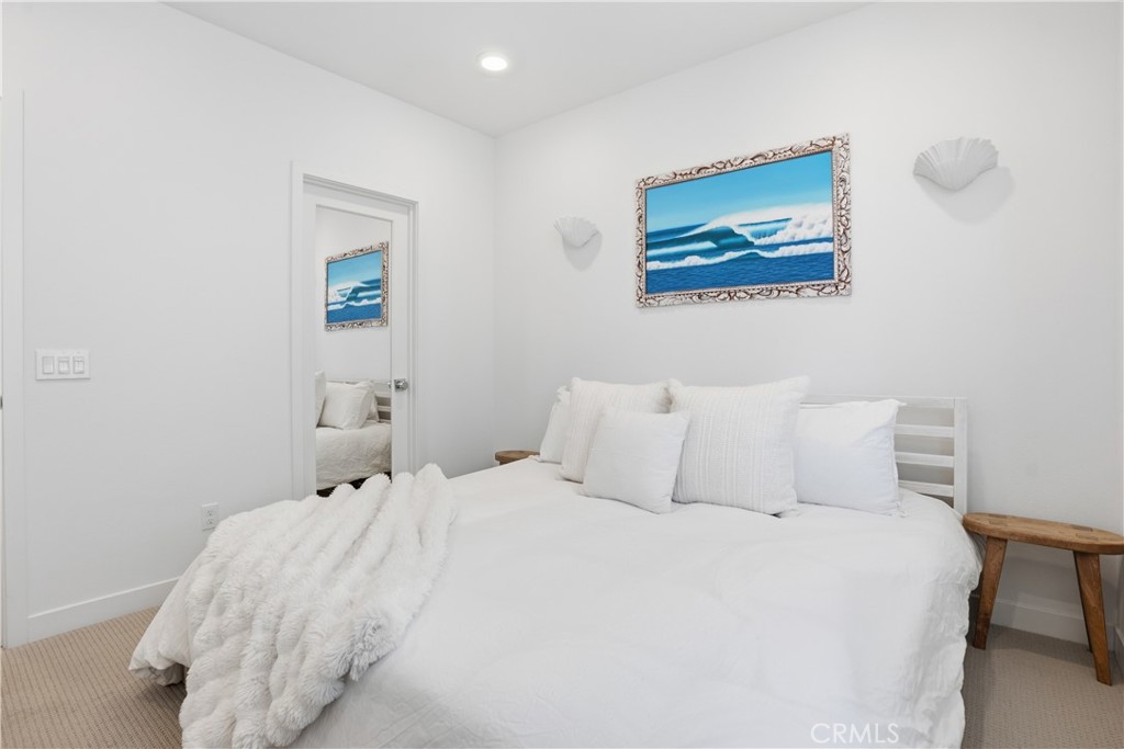1401 Lasso Way, Unit 201 Rancho Mission Viejo, CA 92694 - Photo 11 of 69 a bedroom with a bed and a painting on the wall