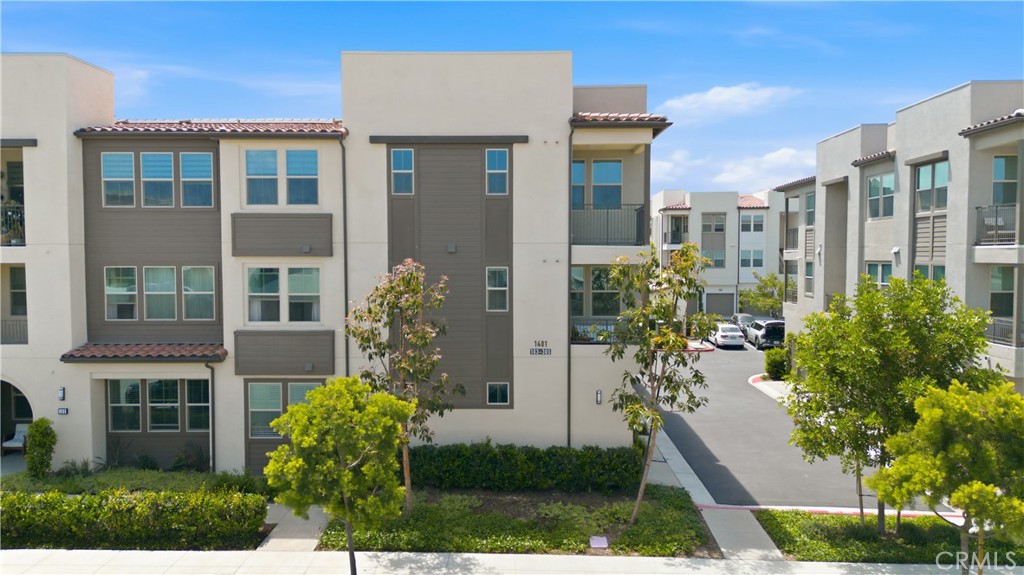 1401 Lasso Way, Unit 201 Rancho Mission Viejo, CA 92694 - Photo 18 of 69 a front view of a house with a yard