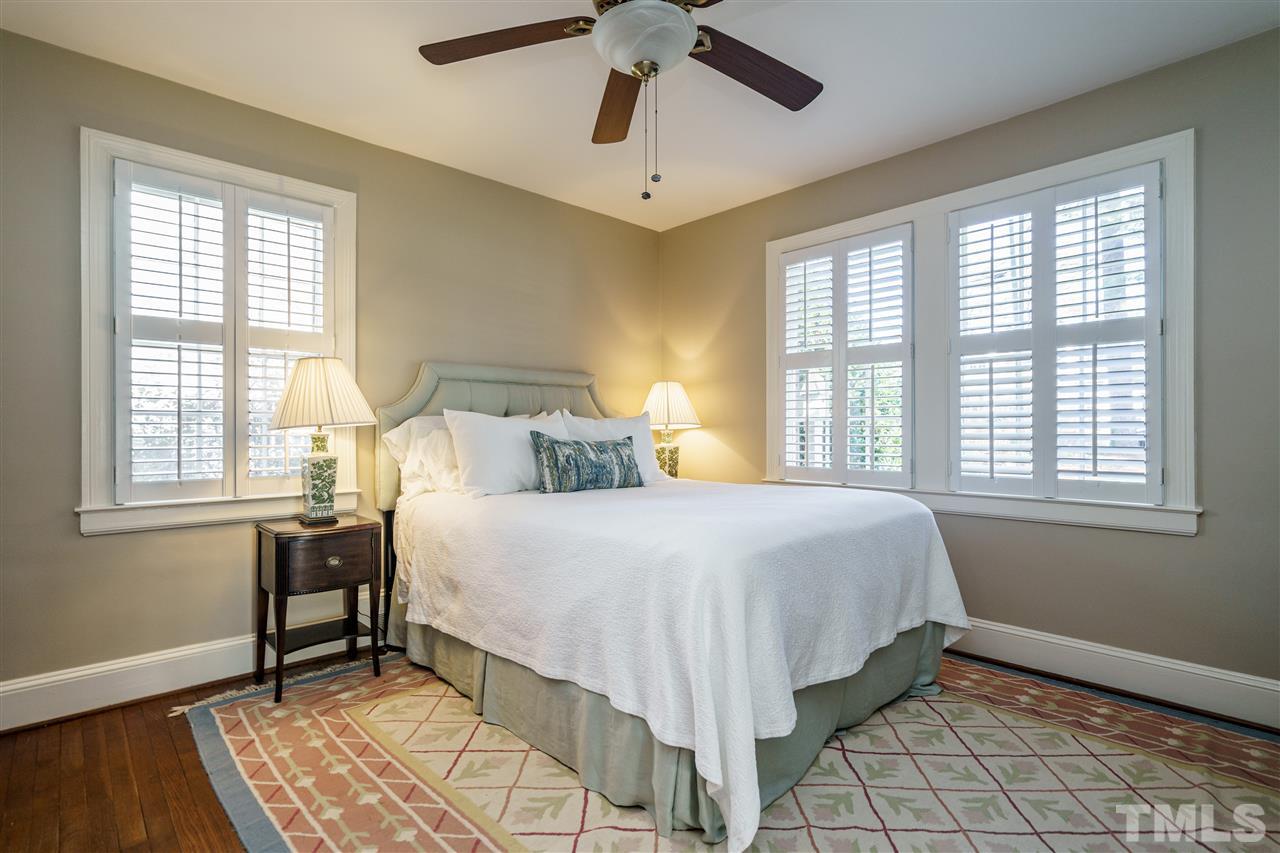 1301 Duplin Road Raleigh, NC 27607 - Photo 14 of 27 a bedroom with a bed and a window