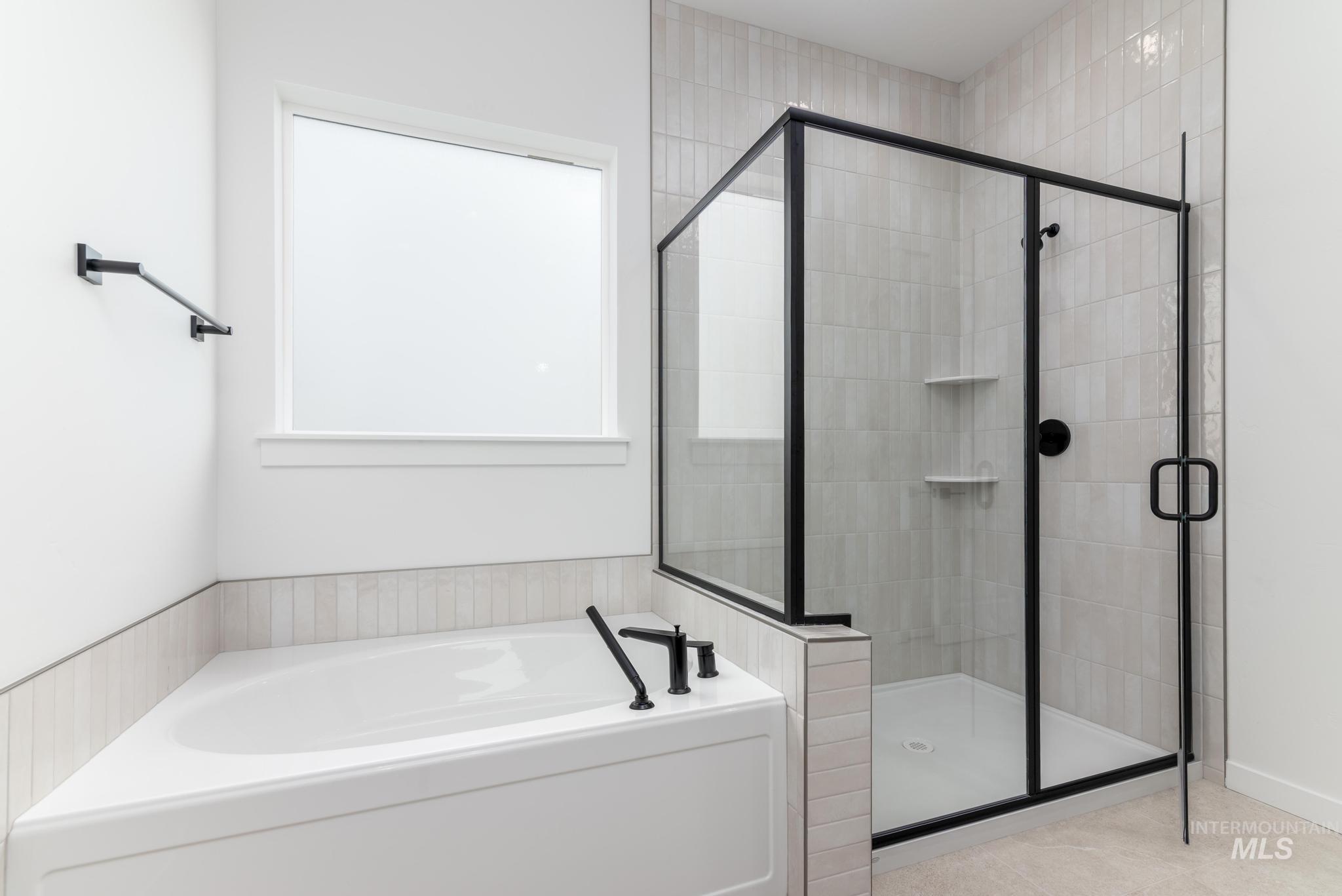 8459 South Country Wind Avenue Meridian, ID 83642 - Photo 9 of 11 Full bath with a stall shower and a bath