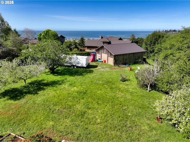 a view of a house with a garden and plants