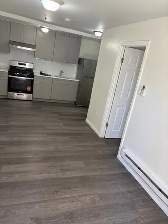 a bathroom with a bathtub and shower