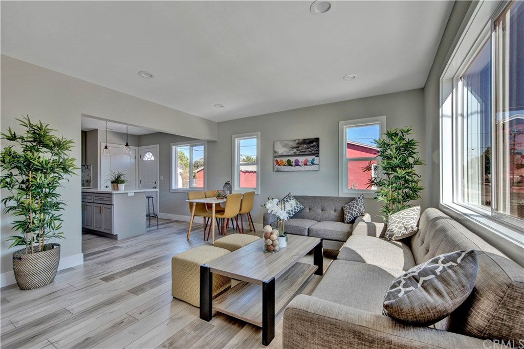 907 West Arbutus Street Compton, CA 90220 - Photo 1 of 1 a living room with furniture potted plant and windows
