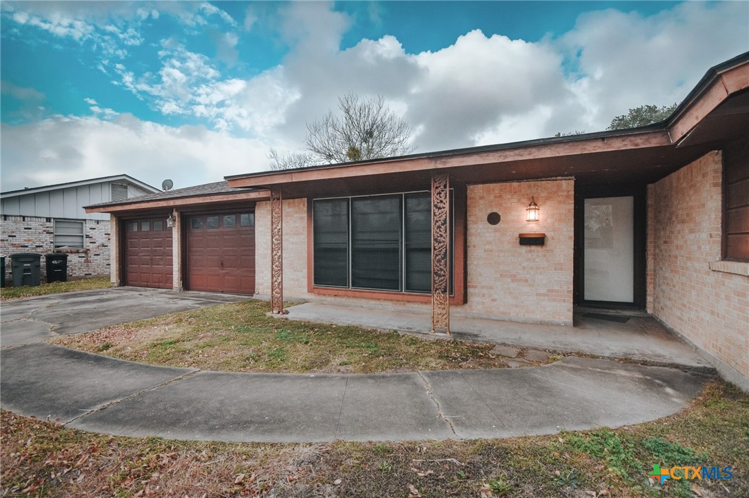 3308 Erwin Avenue Victoria, TX 77901 - Photo 3 of 16 a view of yellow house with a large windows