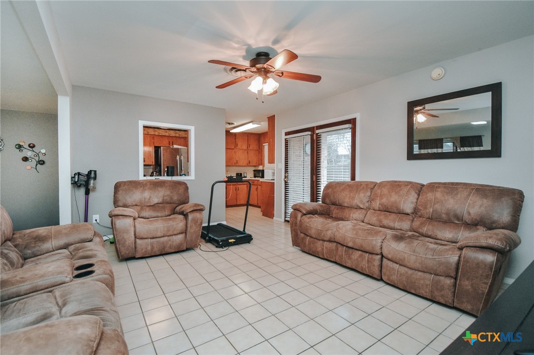 3308 Erwin Avenue Victoria, TX 77901 - Photo 5 of 16 a living room with furniture and a chandelier