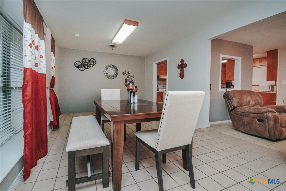 3308 Erwin Avenue Victoria, TX 77901 - Photo 6 of 16 a living room with furniture a couch and a flat screen tv