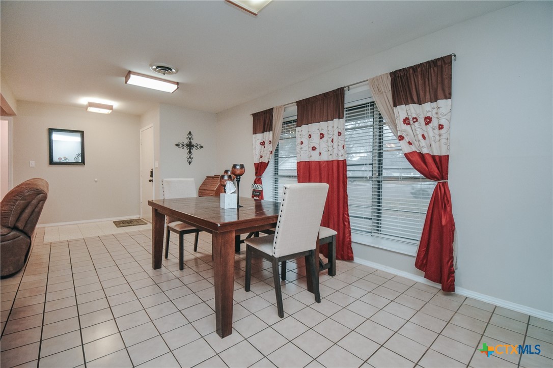 3308 Erwin Avenue Victoria, TX 77901 - Photo 7 of 16 a view of a dining room with furniture and chandelier