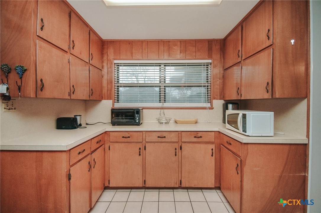 3308 Erwin Avenue Victoria, TX 77901 - Photo 10 of 16 a kitchen with stainless steel appliances granite countertop a sink and cabinets