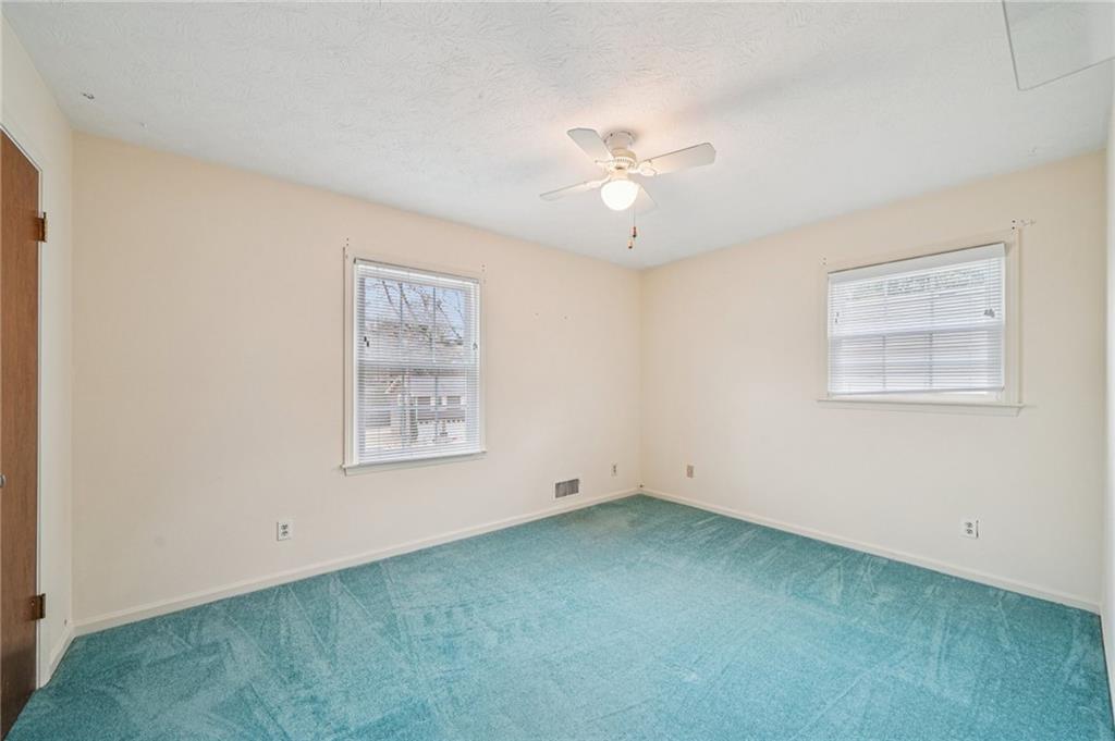 1315 Sanden Ferry Drive Decatur, GA 30033 - Photo 17 of 33 a view of an empty room with a window