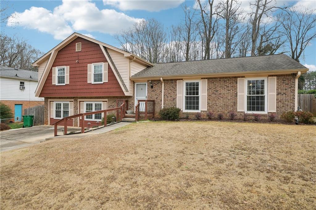 1315 Sanden Ferry Drive Decatur, GA 30033 - Photo 2 of 33 a front view of a house with yard and seating area