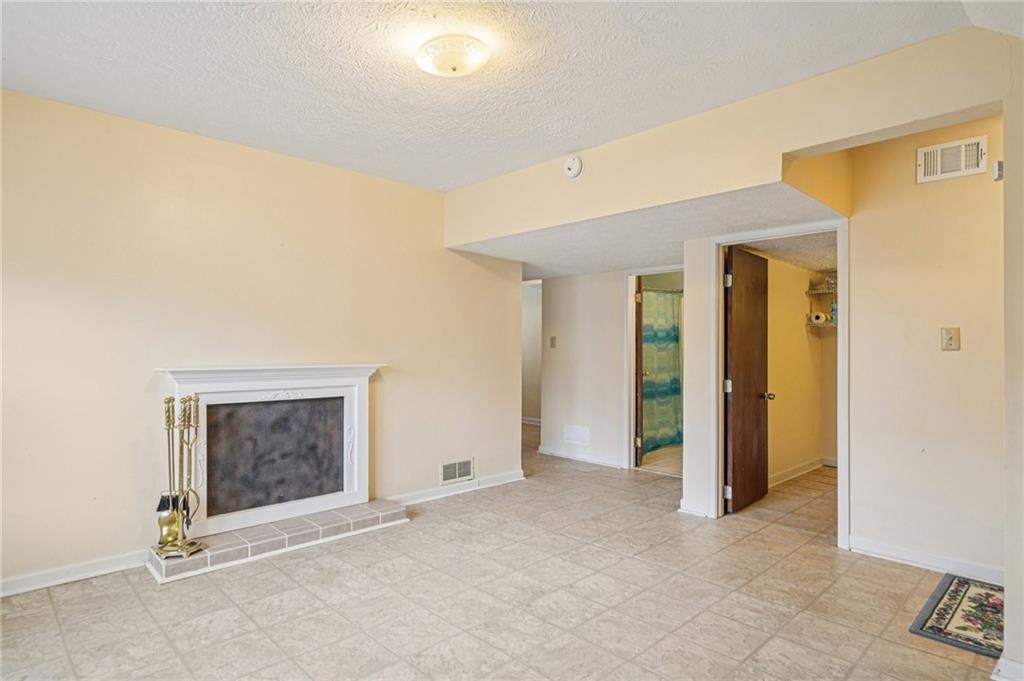 1315 Sanden Ferry Drive Decatur, GA 30033 - Photo 22 of 33 a view of an empty room with closet and a window