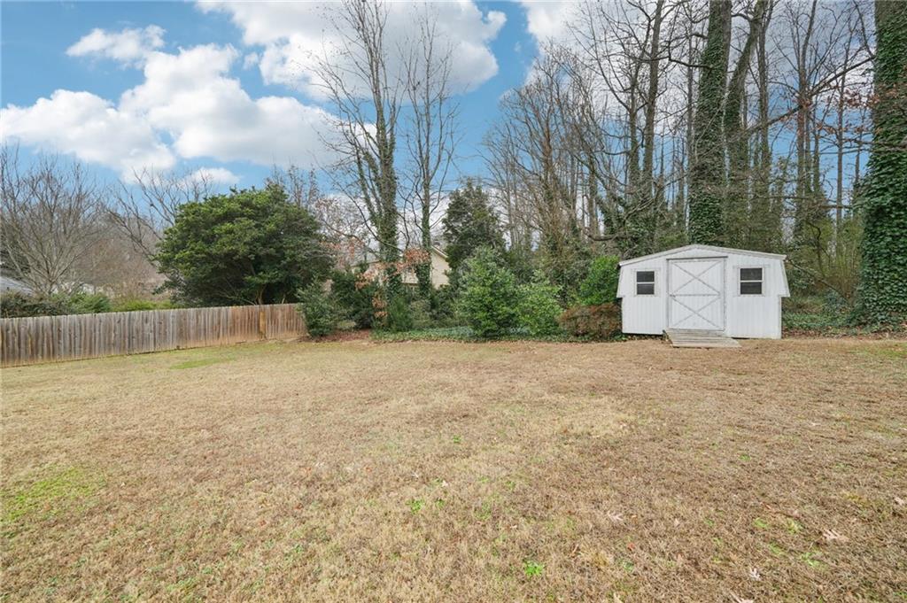 1315 Sanden Ferry Drive Decatur, GA 30033 - Photo 30 of 33 a backyard of a house with lots of green space