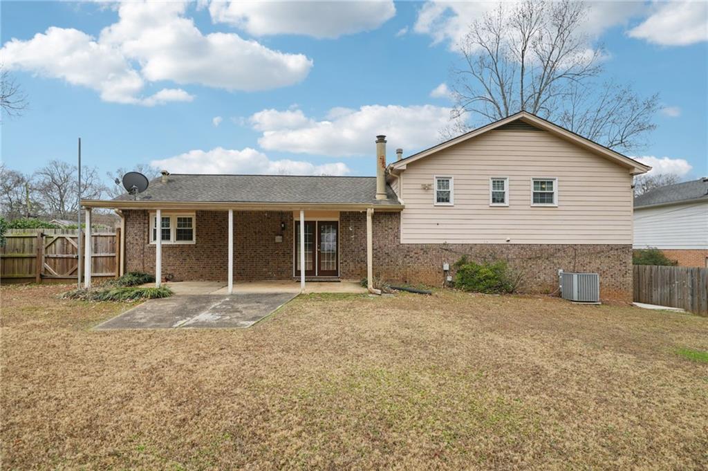 1315 Sanden Ferry Drive Decatur, GA 30033 - Photo 32 of 33 a front view of house with yard and trees around