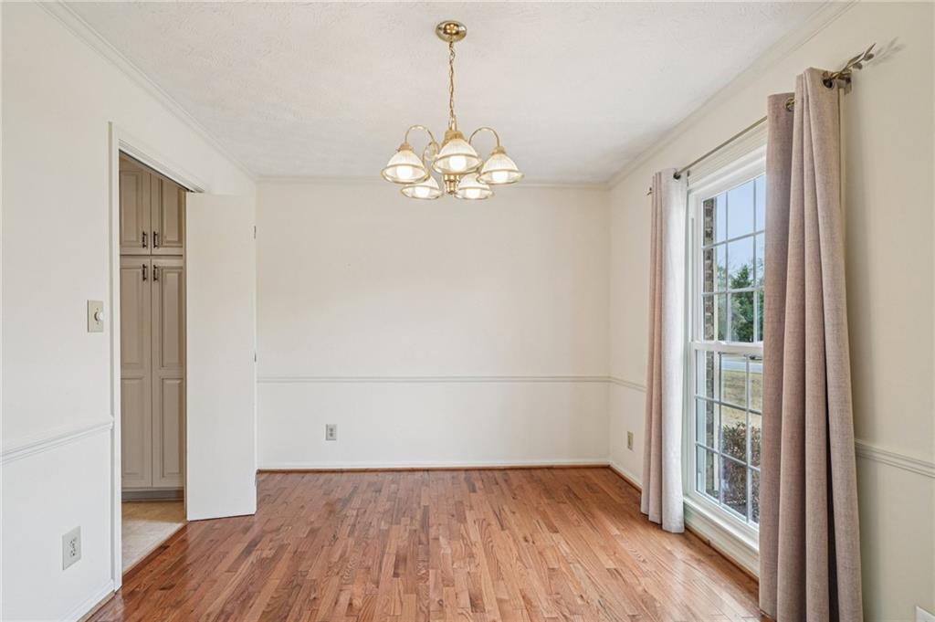 1315 Sanden Ferry Drive Decatur, GA 30033 - Photo 7 of 33 a view of a room with wooden floor chandelier and a window