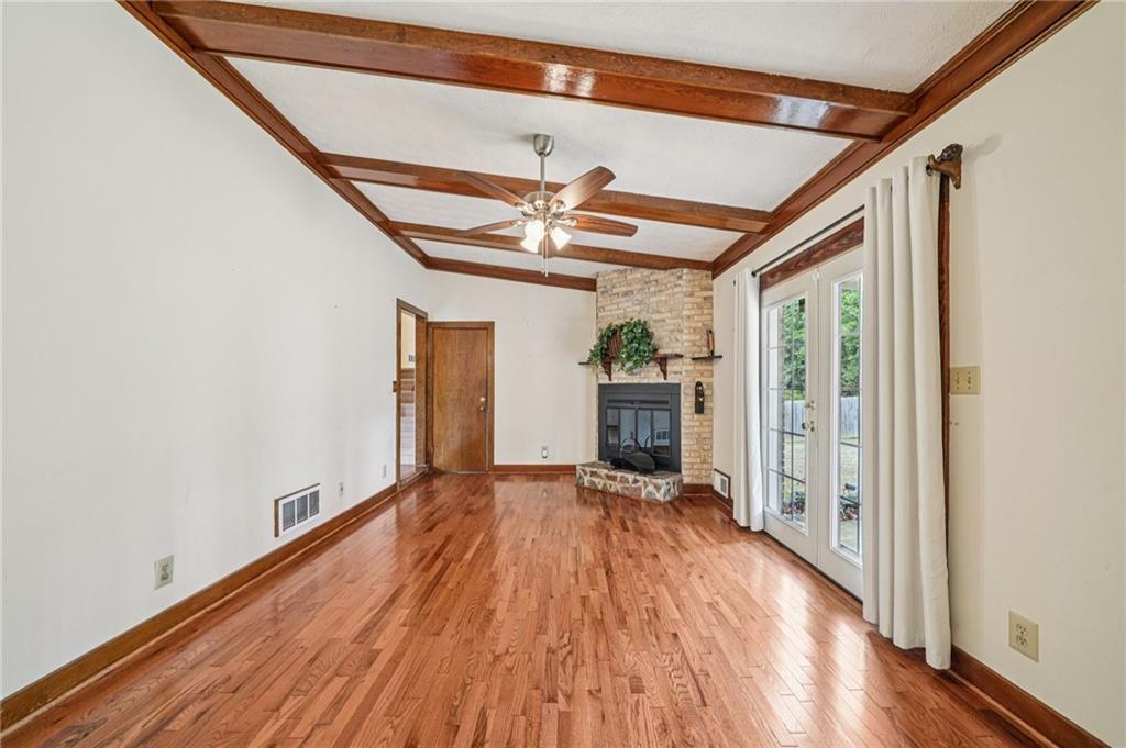 1315 Sanden Ferry Drive Decatur, GA 30033 - Photo 8 of 33 a view of empty room with wooden floor and fan
