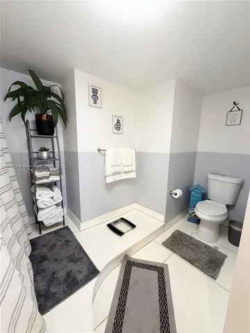 a large white bed in a white room