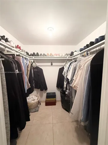 a bathroom with a sink and a black white cabinet
