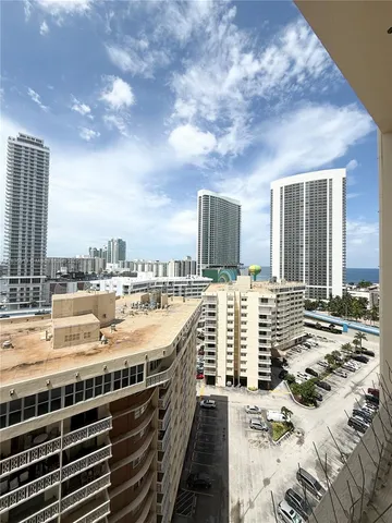 a bedroom with furniture and a large window