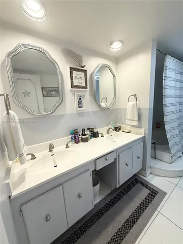 a bedroom with a bed and a potted plant