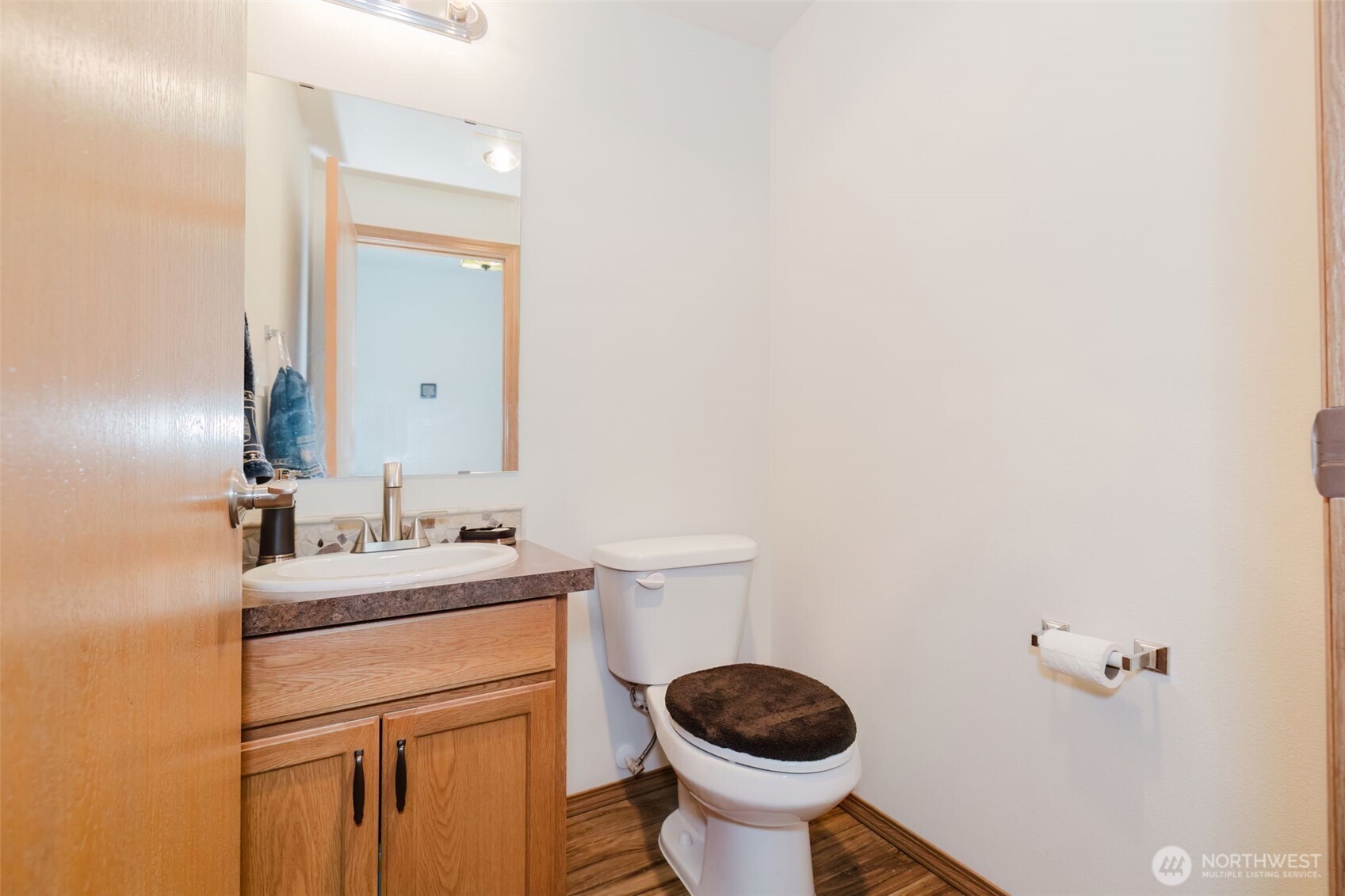 13818 Glenwood Road Southwest Port Orchard, WA 98367 - Photo 14 of 40 a bathroom with a sink and a toilet
