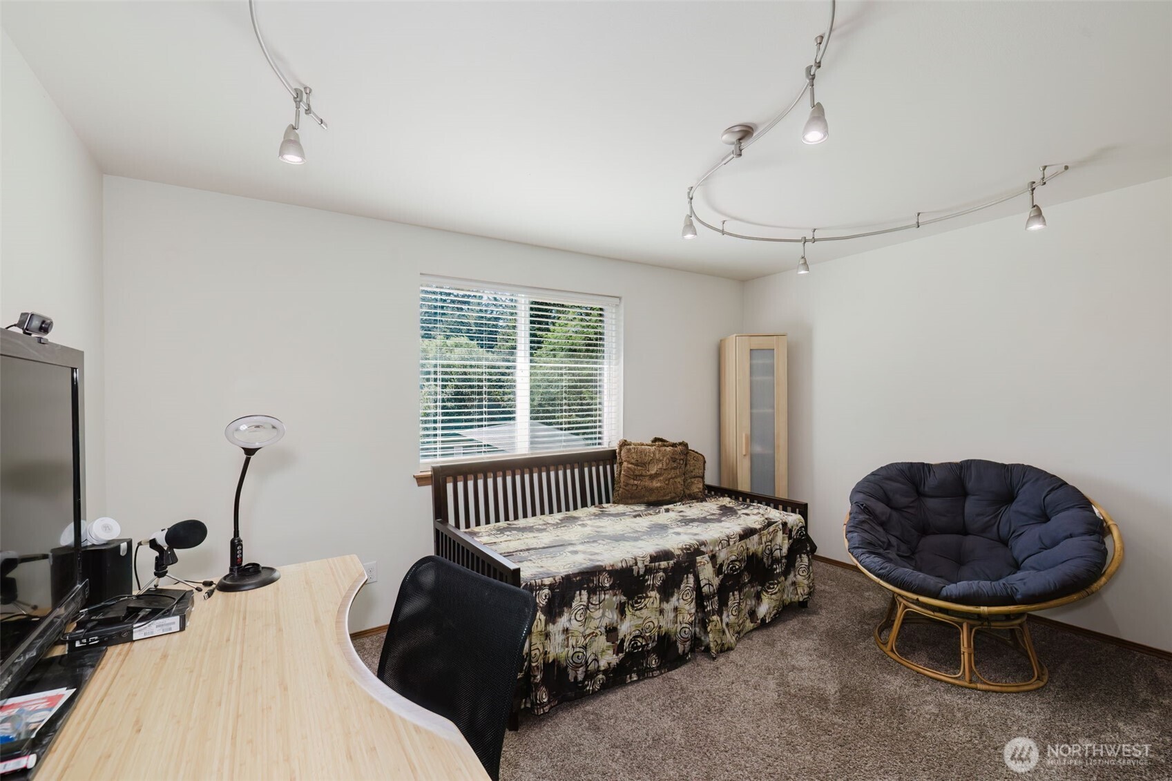 13818 Glenwood Road Southwest Port Orchard, WA 98367 - Photo 23 of 40 a bedroom with bed and a chair