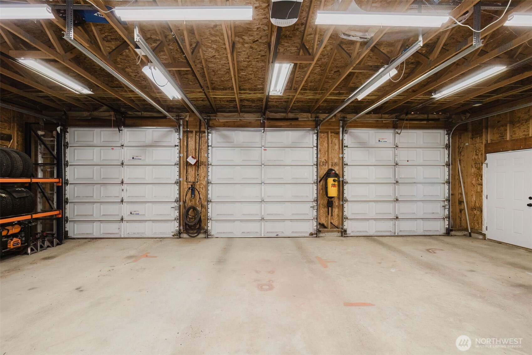 13818 Glenwood Road Southwest Port Orchard, WA 98367 - Photo 28 of 40 a view of a garage room with stairs