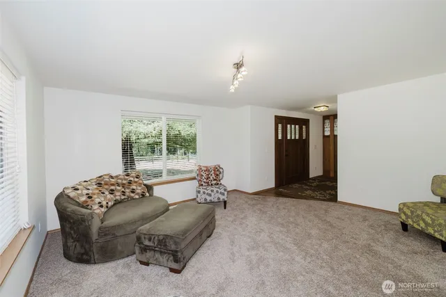 a living room with furniture and window