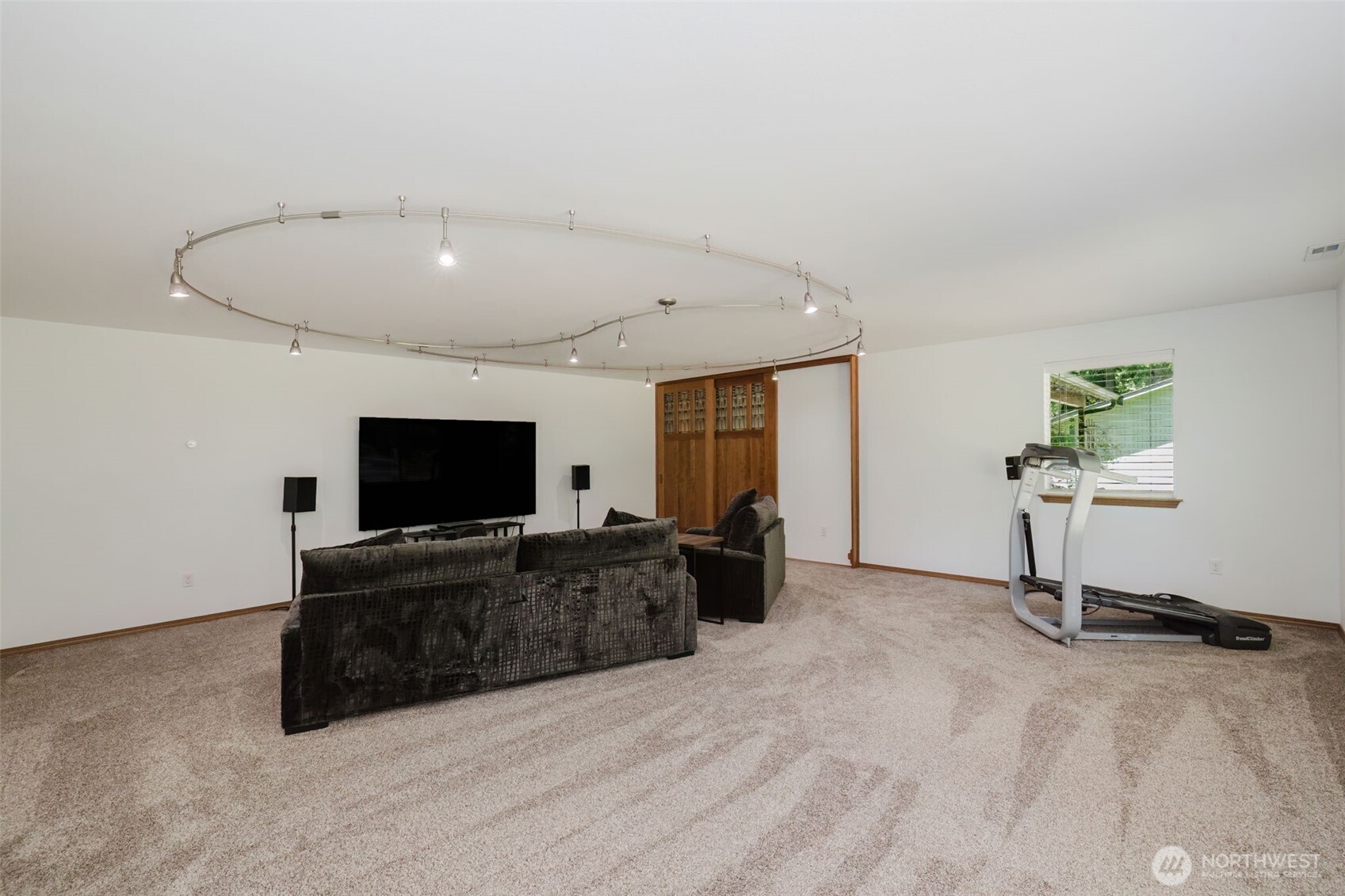 13818 Glenwood Road Southwest Port Orchard, WA 98367 - Photo 9 of 40 a living room with furniture and a flat screen tv