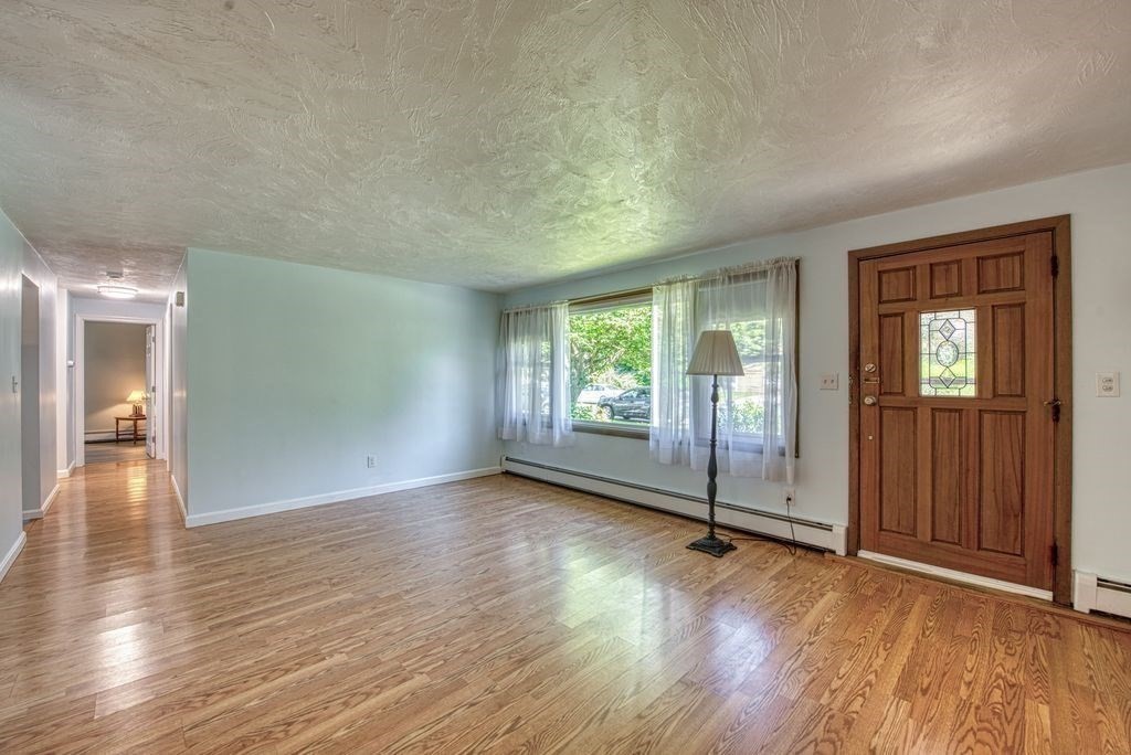 81 Errol Road Brockton, MA 02302 - Photo 7 of 31 wooden floor in an empty room with a window