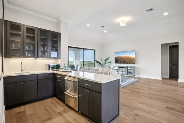 a kitchen with a sink and cabinets