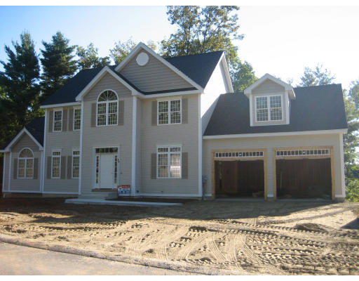 Lot 31 Tannery Road Sturbridge, MA 01518 - Photo 1 of 4 a front view of a house with a yard and garage