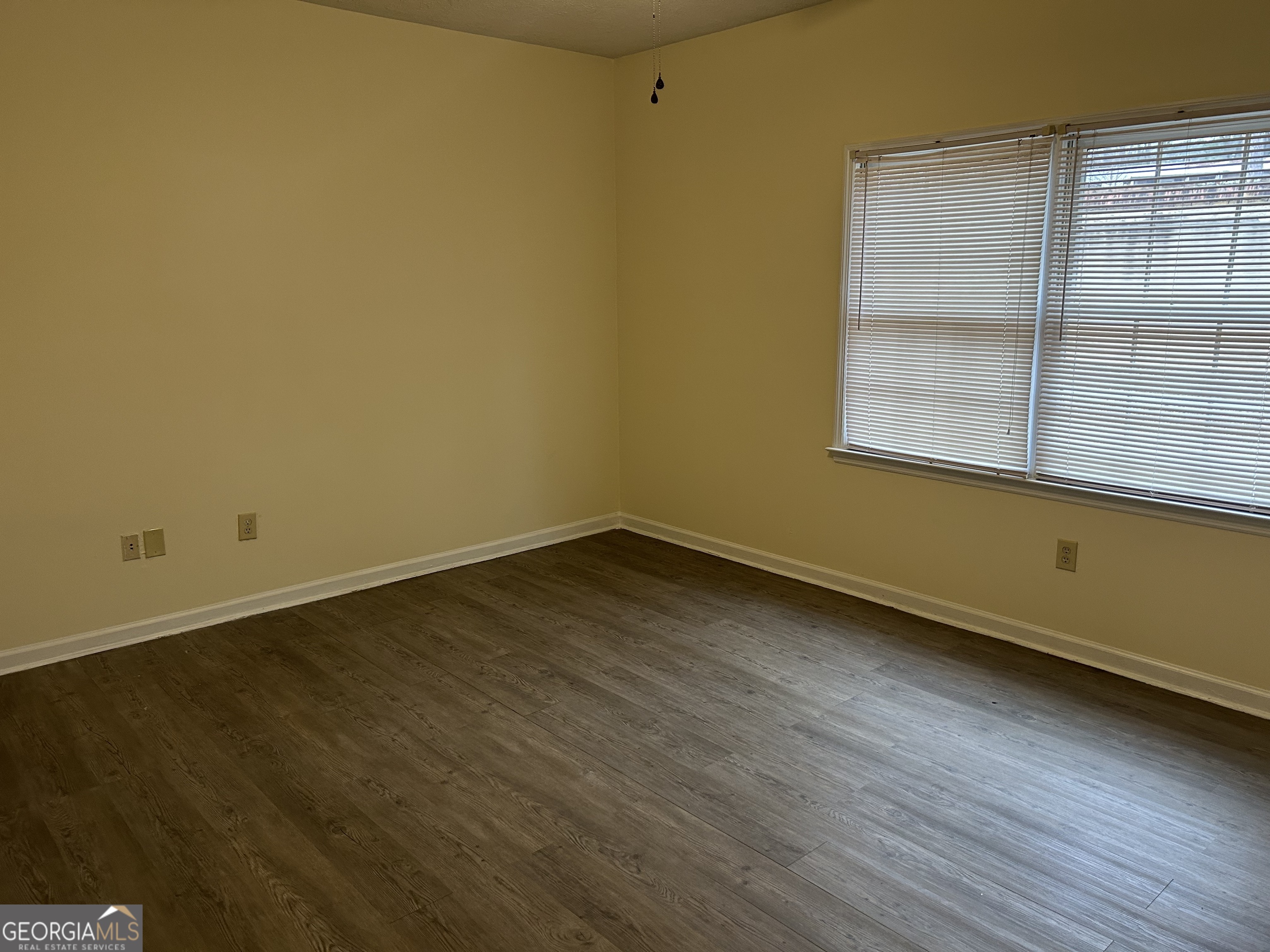 250 Cleveland Road, Unit 219 Bogart, GA 30622 - Photo 12 of 20 wooden floor and window in an empty room