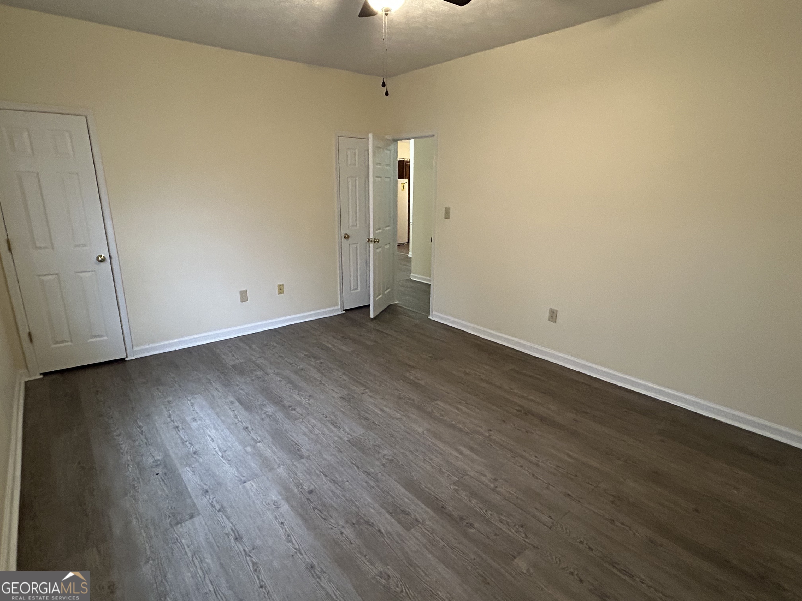 250 Cleveland Road, Unit 219 Bogart, GA 30622 - Photo 13 of 20 a view of a room with wooden floor and mirror