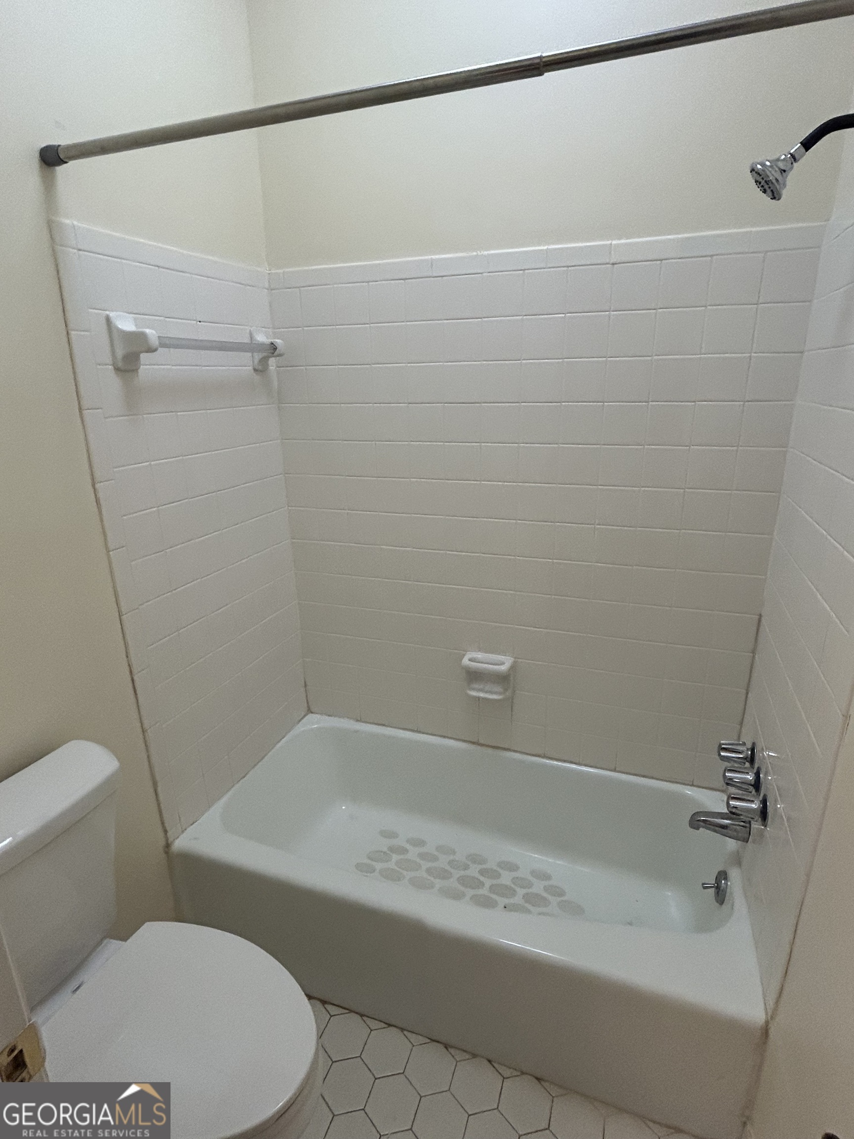250 Cleveland Road, Unit 219 Bogart, GA 30622 - Photo 15 of 20 a bathroom with a toilet and a shower