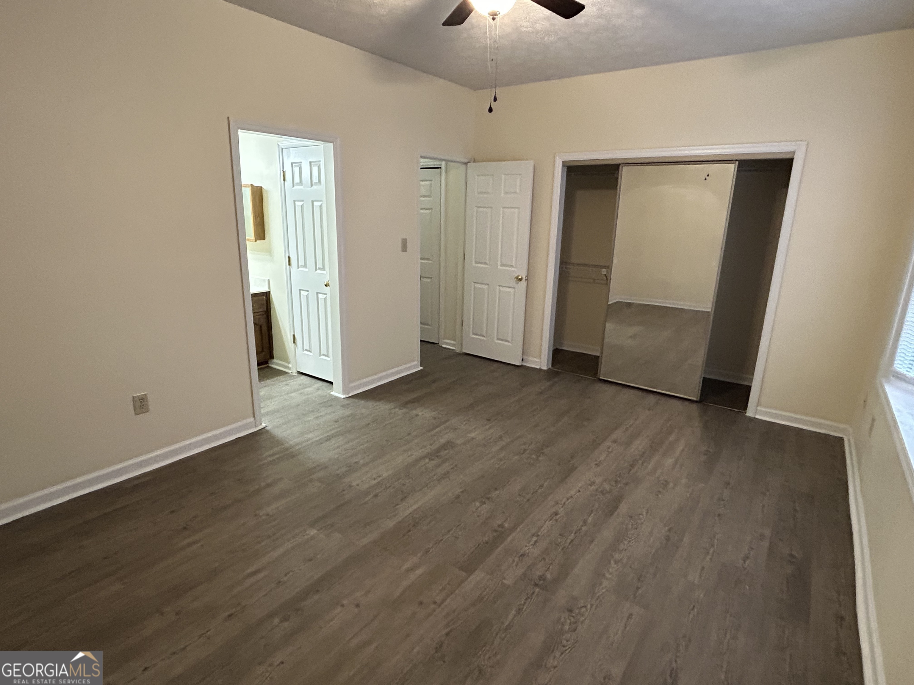 250 Cleveland Road, Unit 219 Bogart, GA 30622 - Photo 18 of 20 wooden floor in an empty room with a window