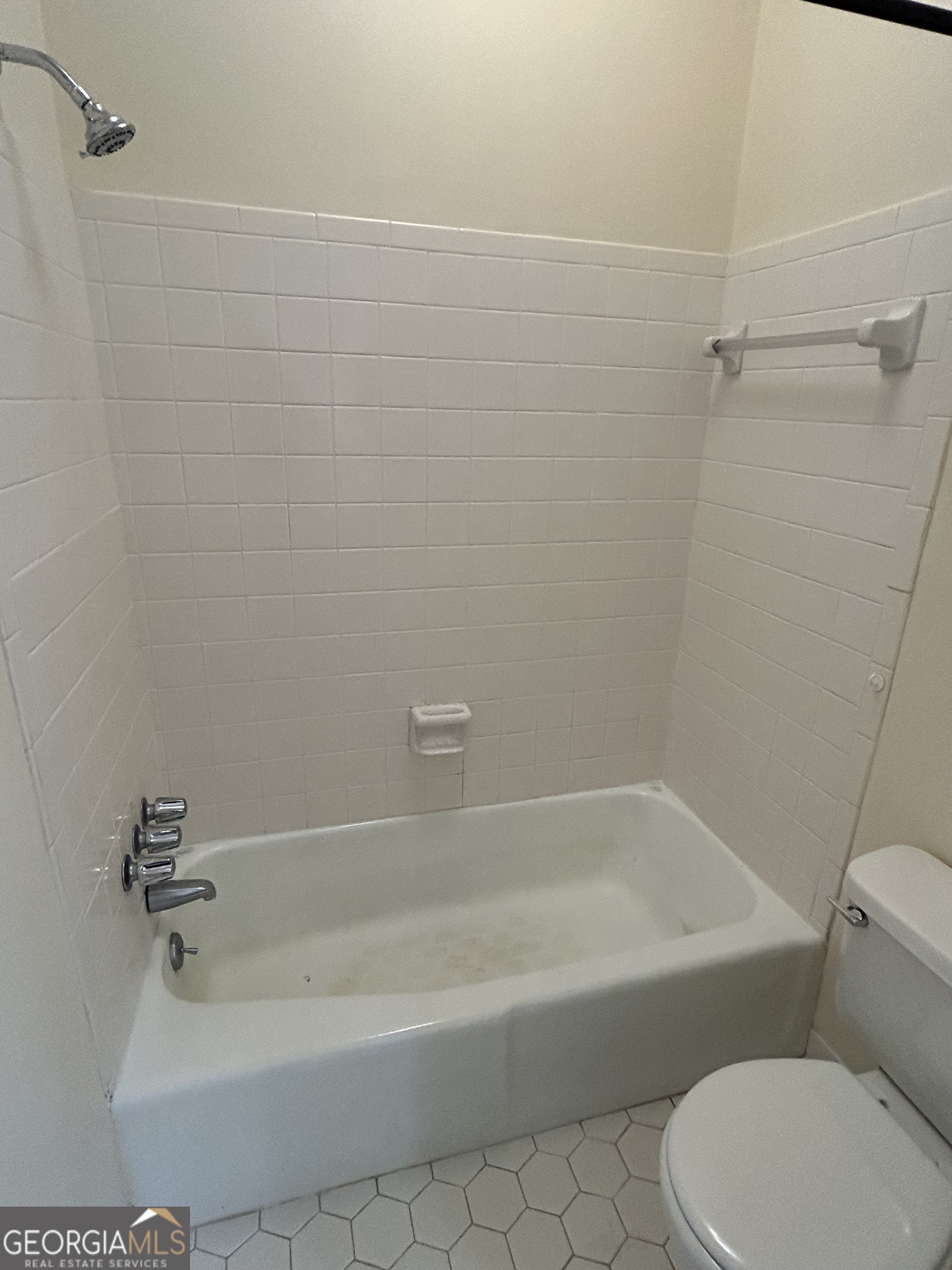 250 Cleveland Road, Unit 219 Bogart, GA 30622 - Photo 19 of 20 a white bath tub sitting next to a white toilet