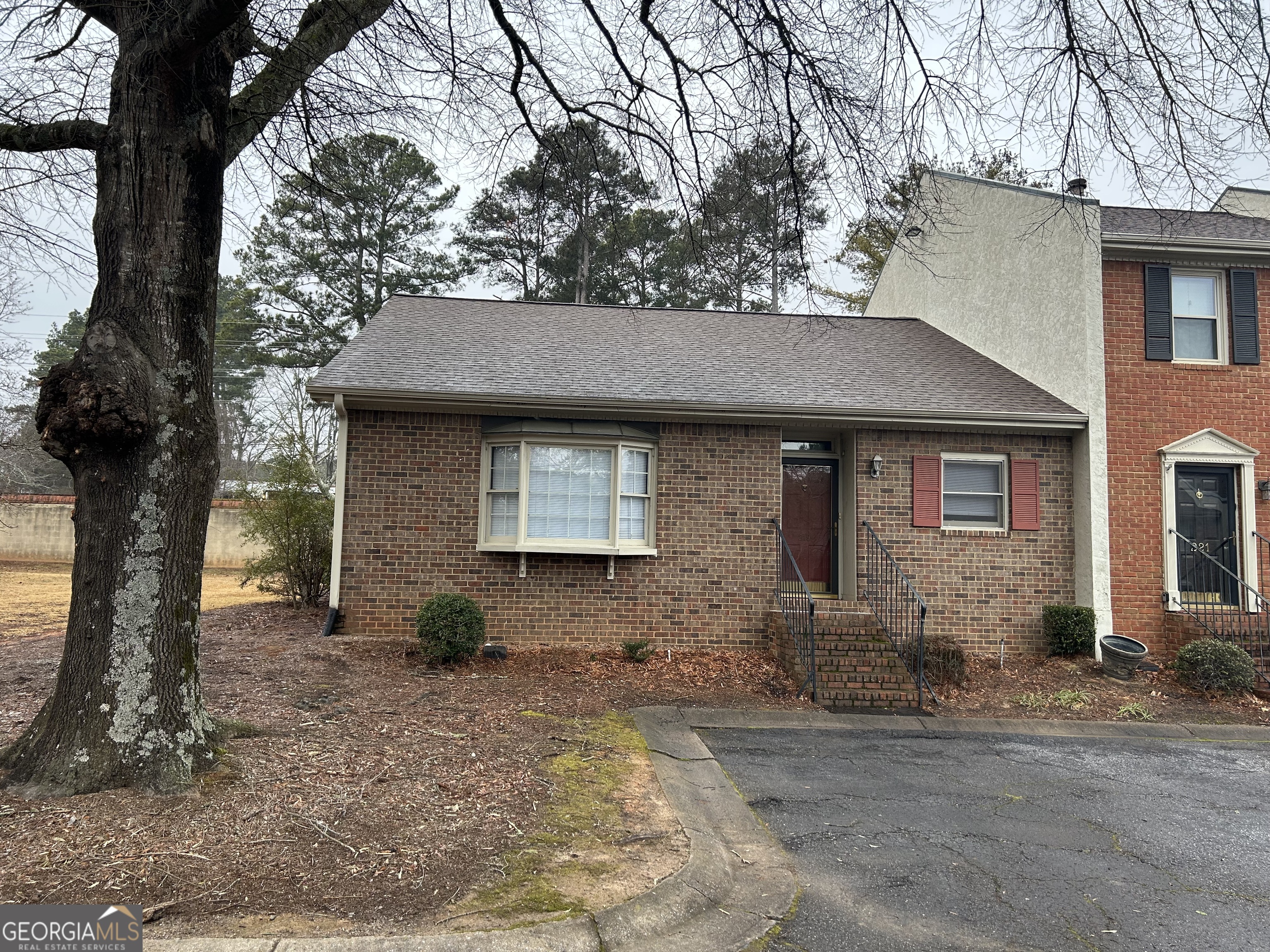 250 Cleveland Road, Unit 219 Bogart, GA 30622 - Photo 2 of 20 a front view of a house with garden